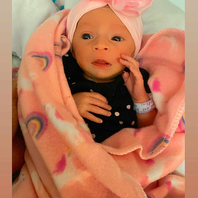 Dayanzy is registered to the contest to win money with this photo: architecture, baby, bed, blanket, bodypart, building, cap, clothing, face, finger, furniture, hat, head, hospital, newborn, person, photography, portrait, quilt, towel