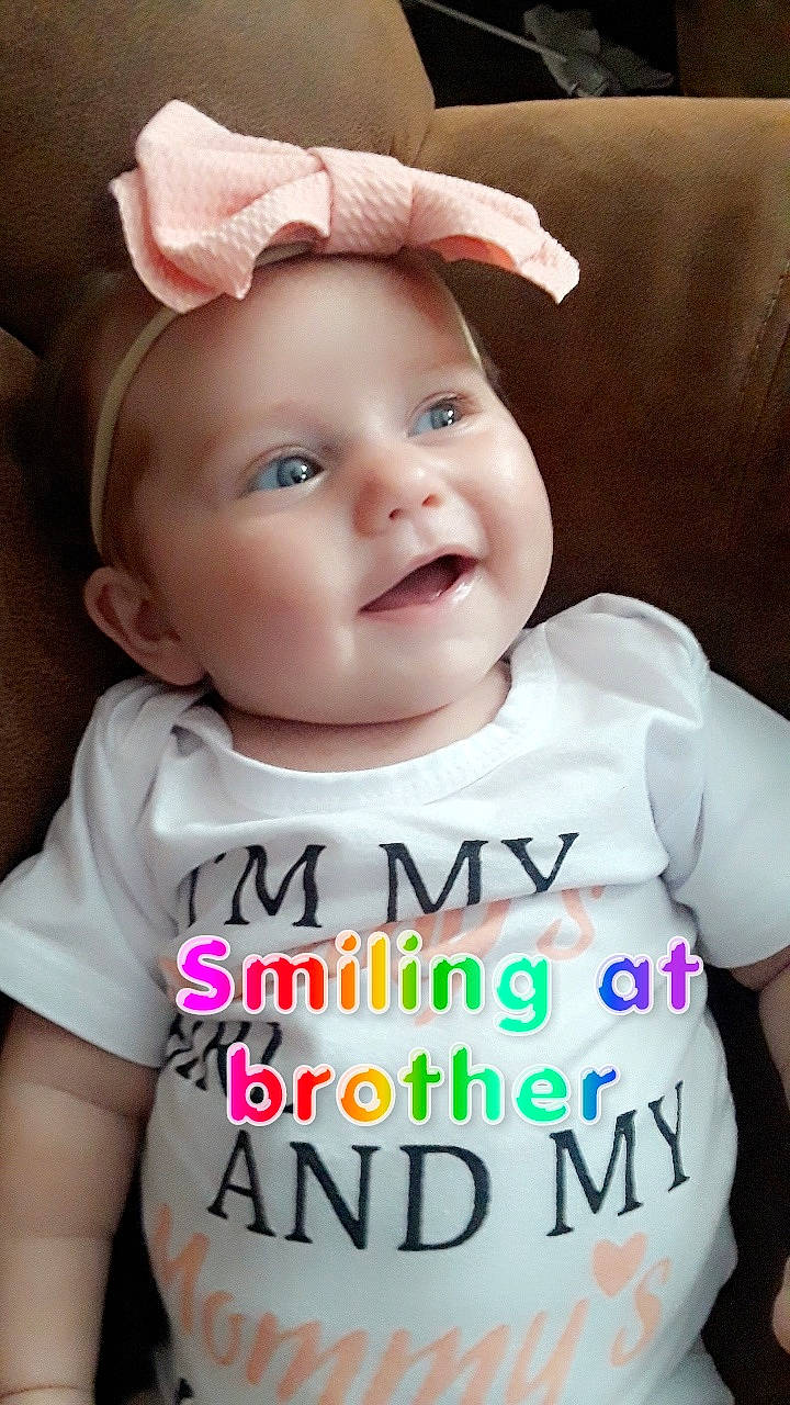 Tinsley is registered to the contest to win money with this photo: baby, baby_products, baby_toddler_clothing, cheek, child, ear, hair_accessory, headband, headgear, headwear, person, photo_caption, product, sleeve, smile, toddler