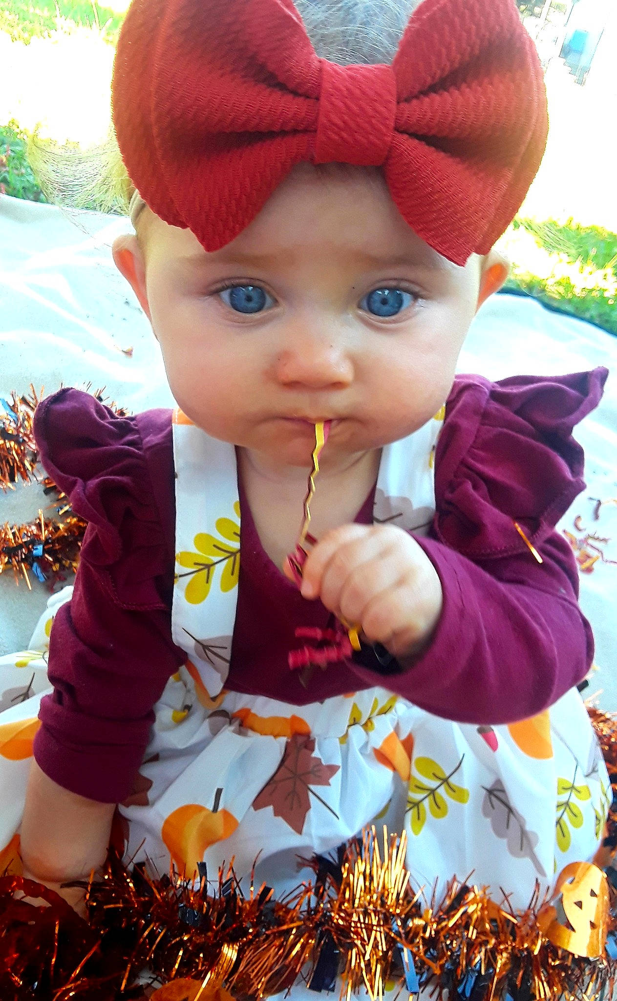 Tinsley is registered to the contest to win money with this photo: baby, cheek, child, ear, hair_accessory, headband, headgear, headwear, leaf, lip, person, plant, skin, smile, toddler