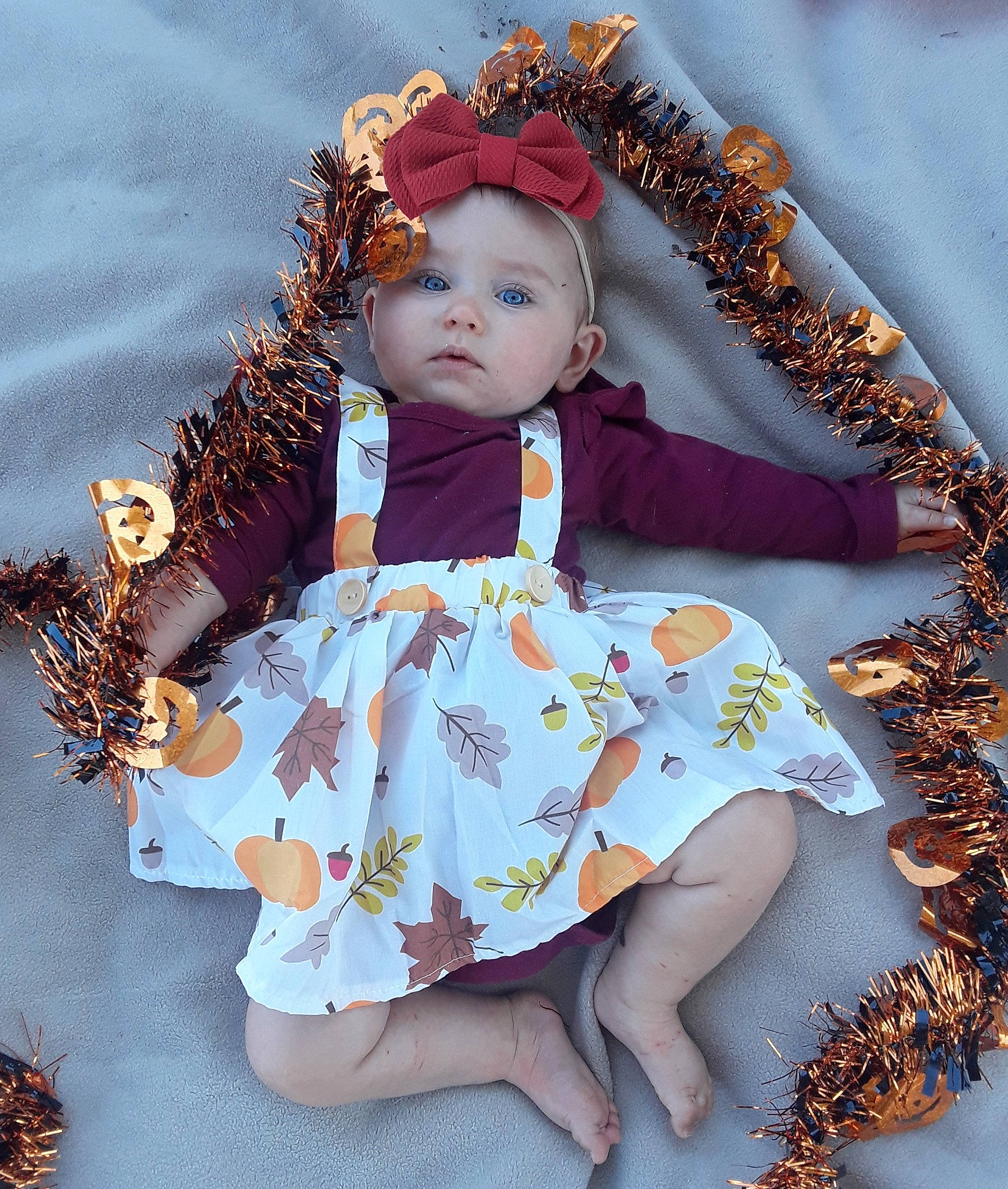 Tinsley joined the competition — help win amazing prizes! autumn, baby, brown_hair, child, child_model, fawn, headwear, leaf, pattern, person, toddler