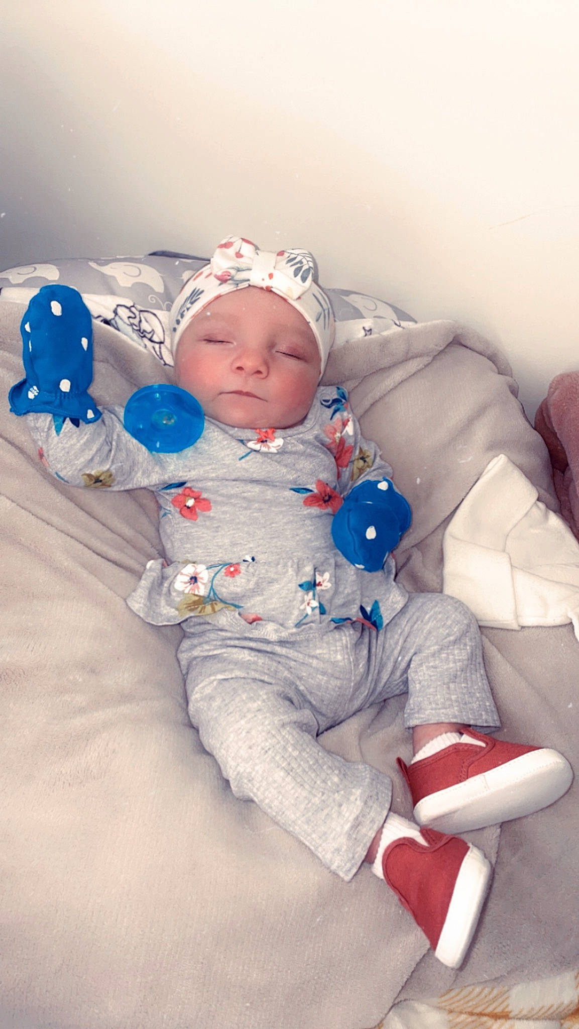 Arianna is registered to the contest to win money with this photo: baby, baby_sleeping, baby_toddler_clothing, cap, carmine, cheek, child, comfort, fun, happy, headwear, linens, person, play, portrait_photography, product, room, sitting, skin, stuffed_toy