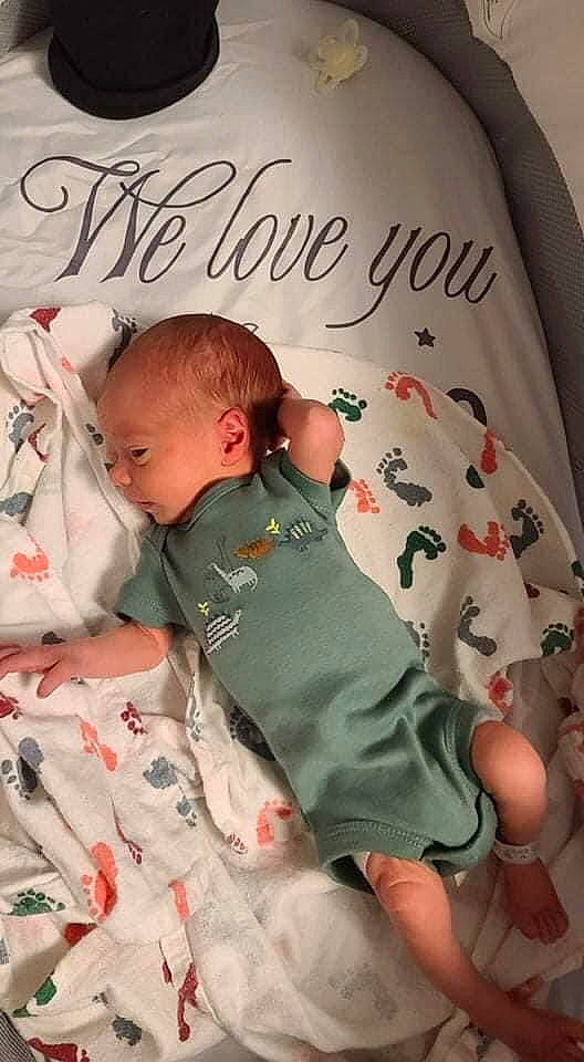 Kolby joined the competition — help win amazing prizes! baby, baby_sleeping, baby_toddler_clothing, bedding, child, comfort, curtain, font, head, linens, mammal, pattern, person, pink, product, room, skin, sleeve, t_shirt, textile