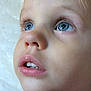 Gwenevere is registered to the contest to win money with this photo: child, face, blue_eyes, close_up, innocence, curiosity, skin, lips, eyelashes, expression, portrait, young, baby, human, mouth, nose, cheeks, natural_light, detail, soft