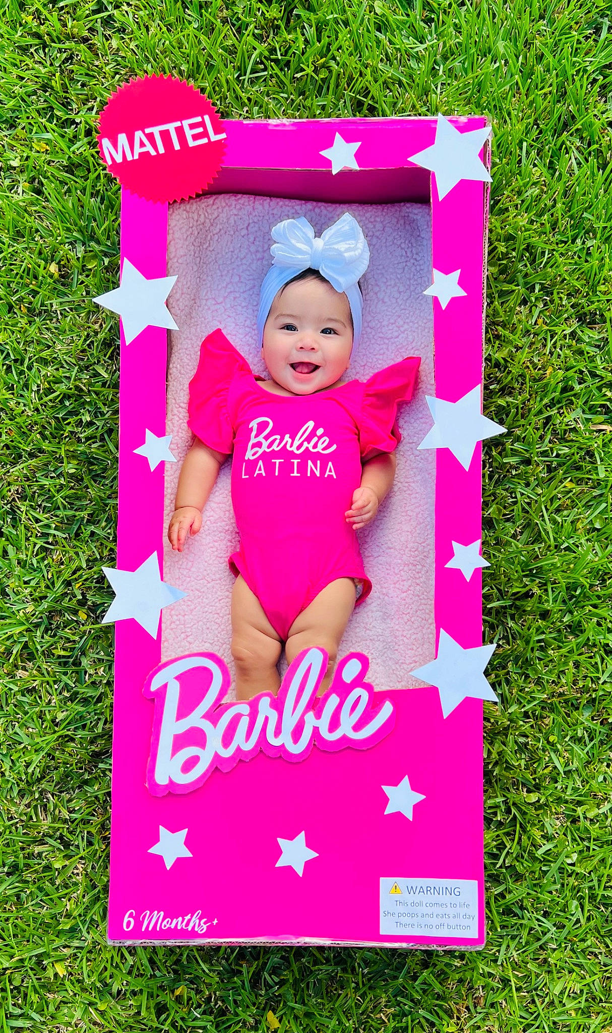 Analia joined the competition — help win amazing prizes! advertising, baby, baby_toddler_clothing, child, font, grass, happy, headwear, magenta, paper_product, pattern, people_in_nature, person, photo_caption, pink, poster, rectangle, shorts, t_shirt, textile