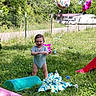 baby, grass, outdoor, balloon, birthday, towel, toy, child, greenery, summer, play, happy, smile, standing, nature, daylight, clothing, fence, house, slide