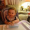Jaxson joined the competition — help win amazing prizes! baby, bottle, child, couch, cozy, curtains, decor, furniture, high_chair, home, indoor, interior, lamp, living_room, person, seat, smiling, table, toddler, toy