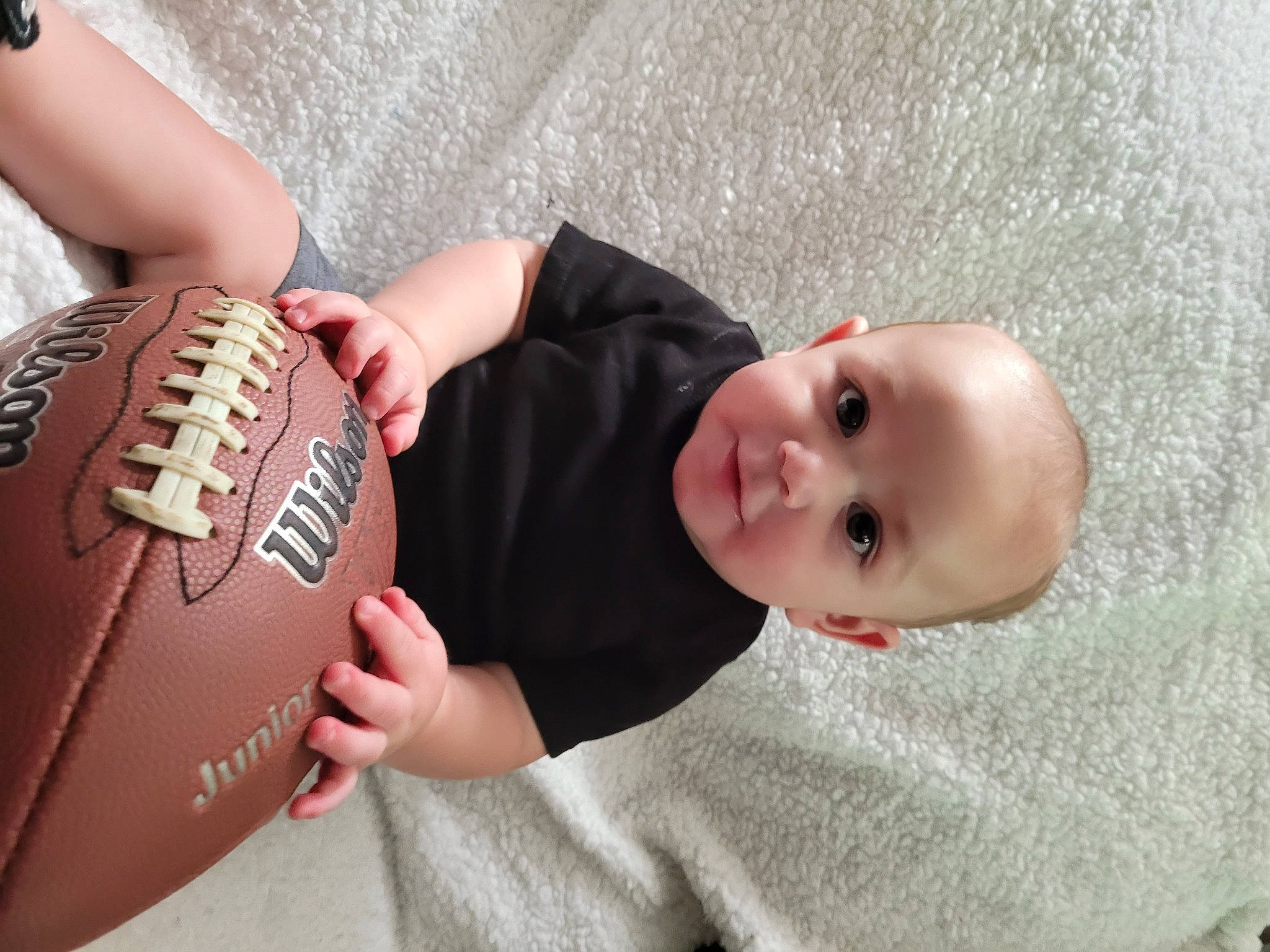 Estevan joined the competition — help win amazing prizes! arm, baby, baby_toddler_clothing, ball, ball_game, baseball_glove, child, elbow, finger, football, gesture, hand, joint, people, person, personal_protective_equipment, sports_equipment, sports_gear, team_sport, toddler