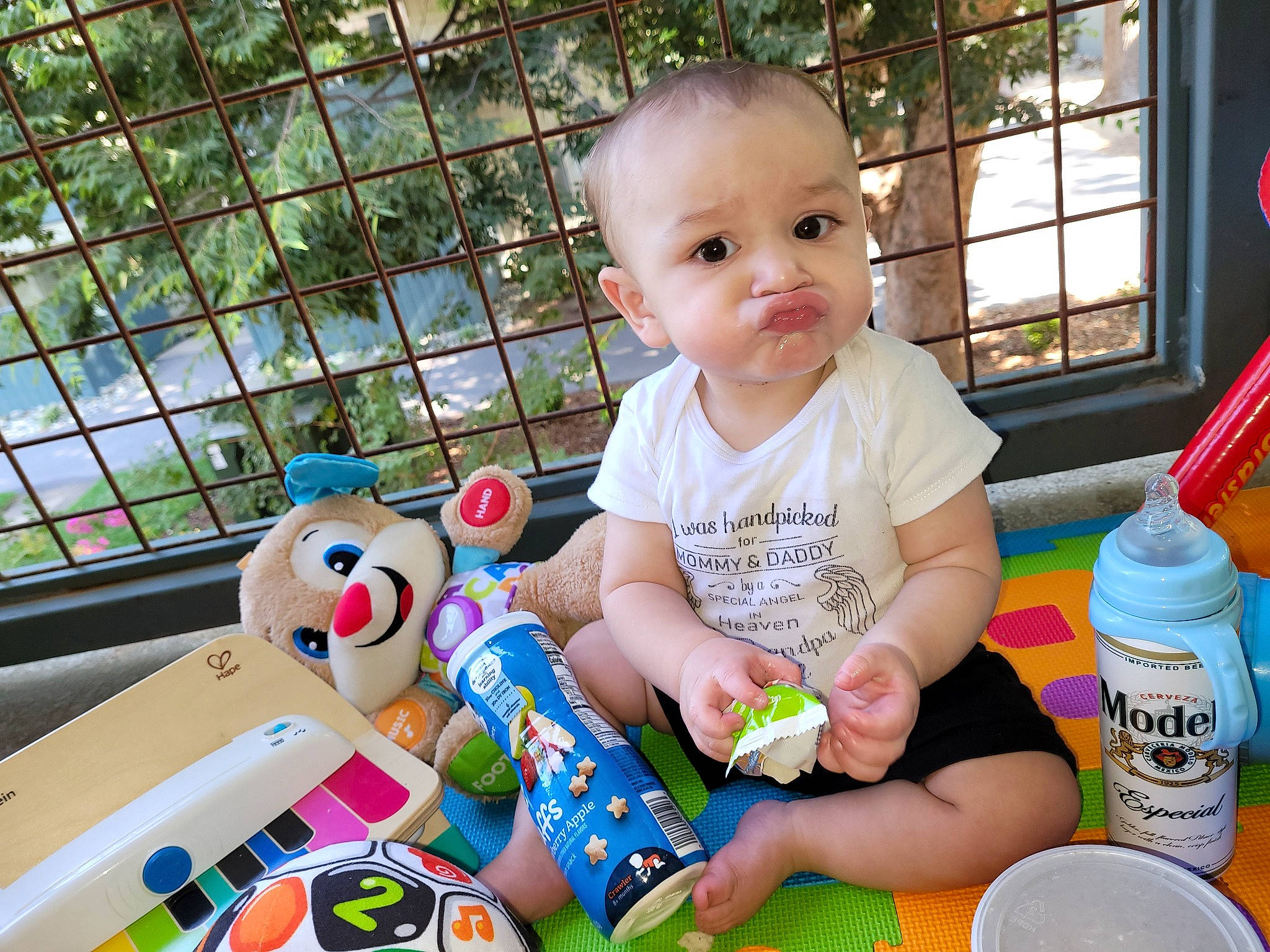 Estevan is registered to the contest to win money with this photo: baby, baby_playing_with_toys, baby_toddler_clothing, beauty, cheek, child, facial_expression, fun, happy, leisure, people, person, product, skin, smile, summer, t_shirt, toddler, toy, window