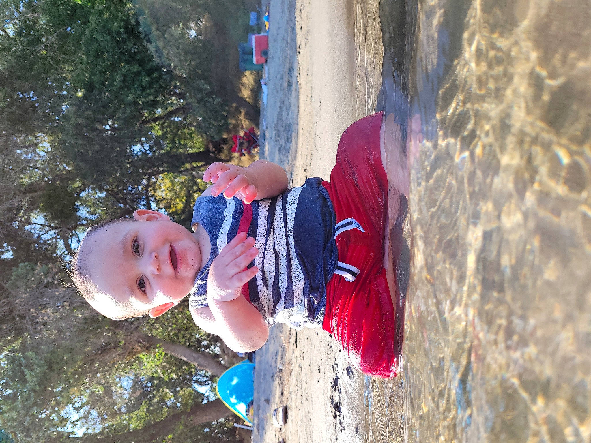 Estevan is registered to the contest to win money with this photo: adventure, baby, child, electric_blue, fun, happy, hat, leaf, leisure, people_in_nature, person, plant, play, recreation, smile, toddler, tree, vacation, water, winter