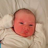 Sebastian is registered to the contest to win money with this photo: newborn, baby, infant, blanket, hospital, white_clothing, lying_down, face, skin, bed_sheet, small_hands, cute, sleepwear, portrait, resting, human, fresh, young, indoors, closeup