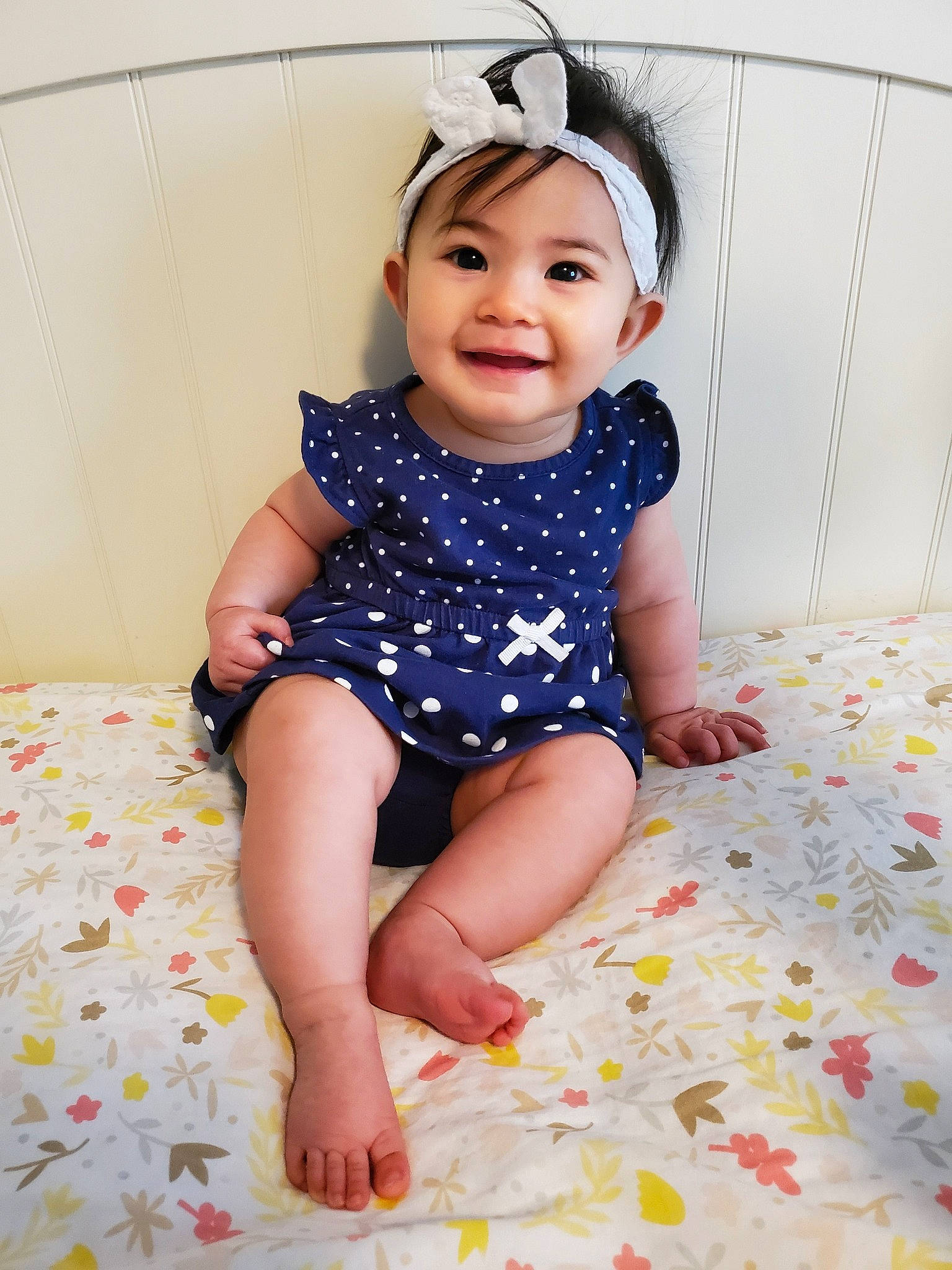 Rowyn is registered to the contest to win money with this photo: baby, baby_bloomers, baby_products, baby_toddler_clothing, beauty, child, child_model, design, dress, headgear, headwear, joy, leg, pattern, person, pink, sitting, skin, sleeve, smile