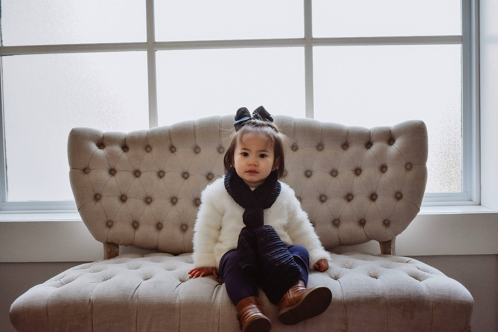 Rowyn is registered to the contest to win money with this photo: child, comfort, couch, cushion, design, fur, furniture, interior_design, pattern, person, pillow, room, sitting, sofa_bed, toddler