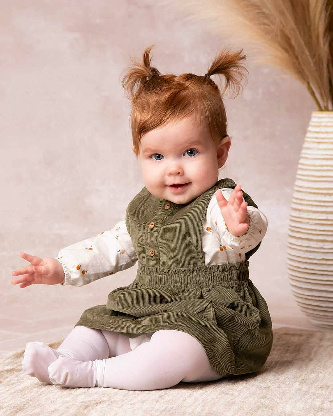 Lorelai is registered to the contest to win money with this photo: baby, baby_toddler_clothing, cheek, child, dress, eye, fawn, flooring, foot, happy, human_leg, iris, joint, joy, neck, person, shoulder, skin, sleeve, smile
