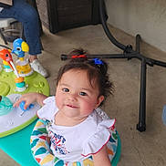 Sophia joined the competition — help win amazing prizes! adult, baby_walker, casual, chair, child, colorful, face, floor, hair_ties, hand, indoor, jeans, person, plastic, play, shoe, smiling, toddler, toy, white_clothing