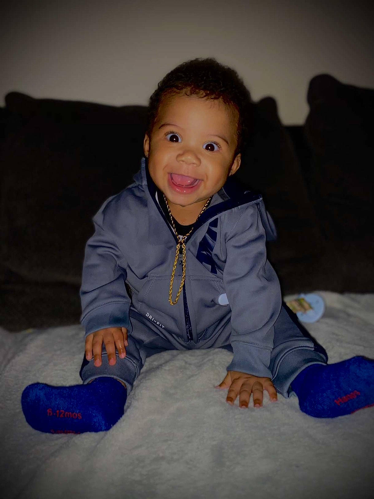 Daylen is registered to the contest to win money with this photo: baby_toddler_clothing, cheek, child, comfort, cool, eye, facial_expression, finger, flash_photography, fun, happy, human_body, iris, mouth, nose, organ, person, shoe, sitting, skin