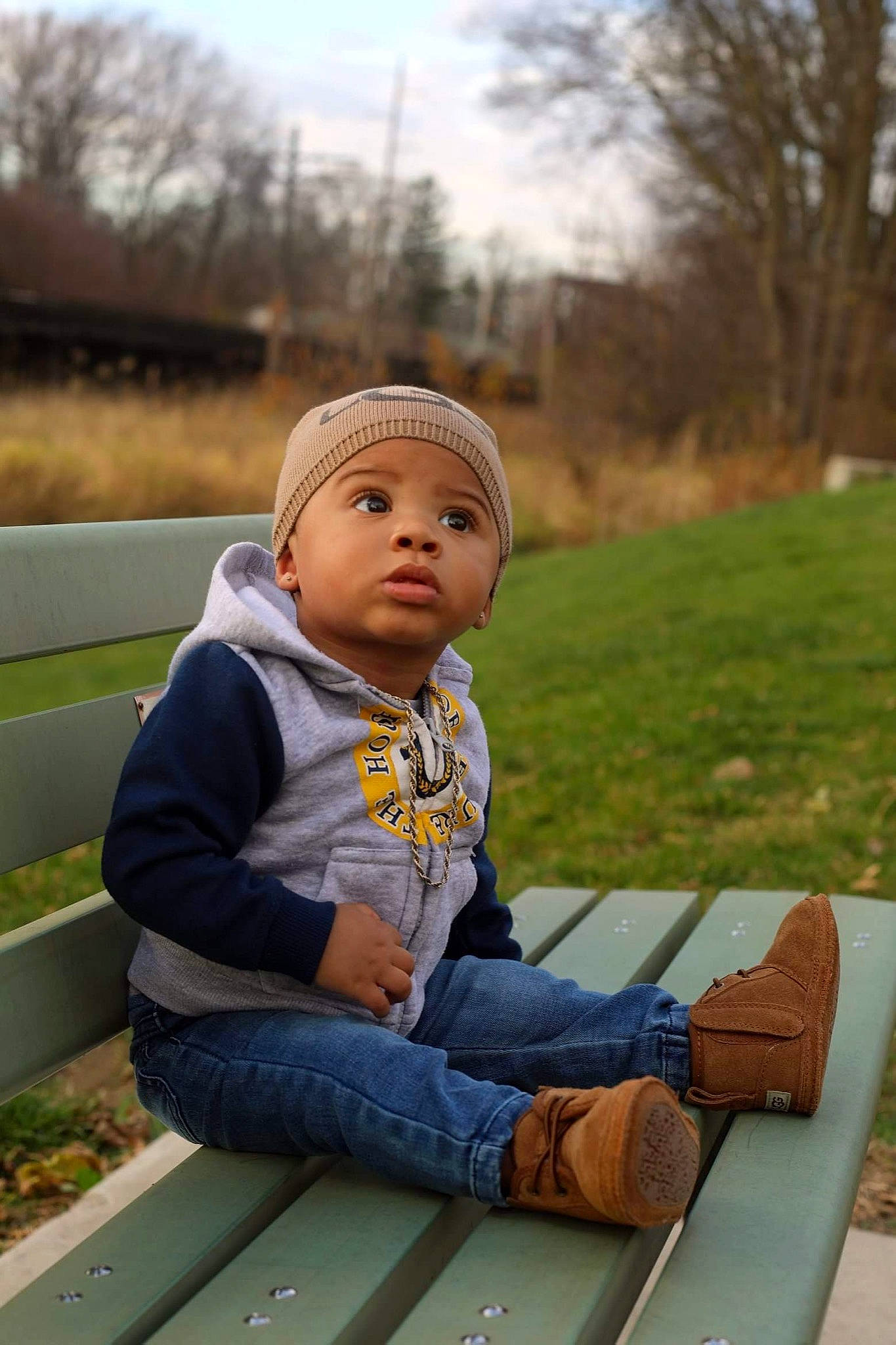 Daylen joined the competition — help win amazing prizes! baby, baby_toddler_clothing, balance, beanie, bench, bonnet, child, denim, headwear, hoodie, jeans, lap, leisure, outdoor_bench, outdoor_furniture, outdoor_shoe, person, play, sitting, sneakers