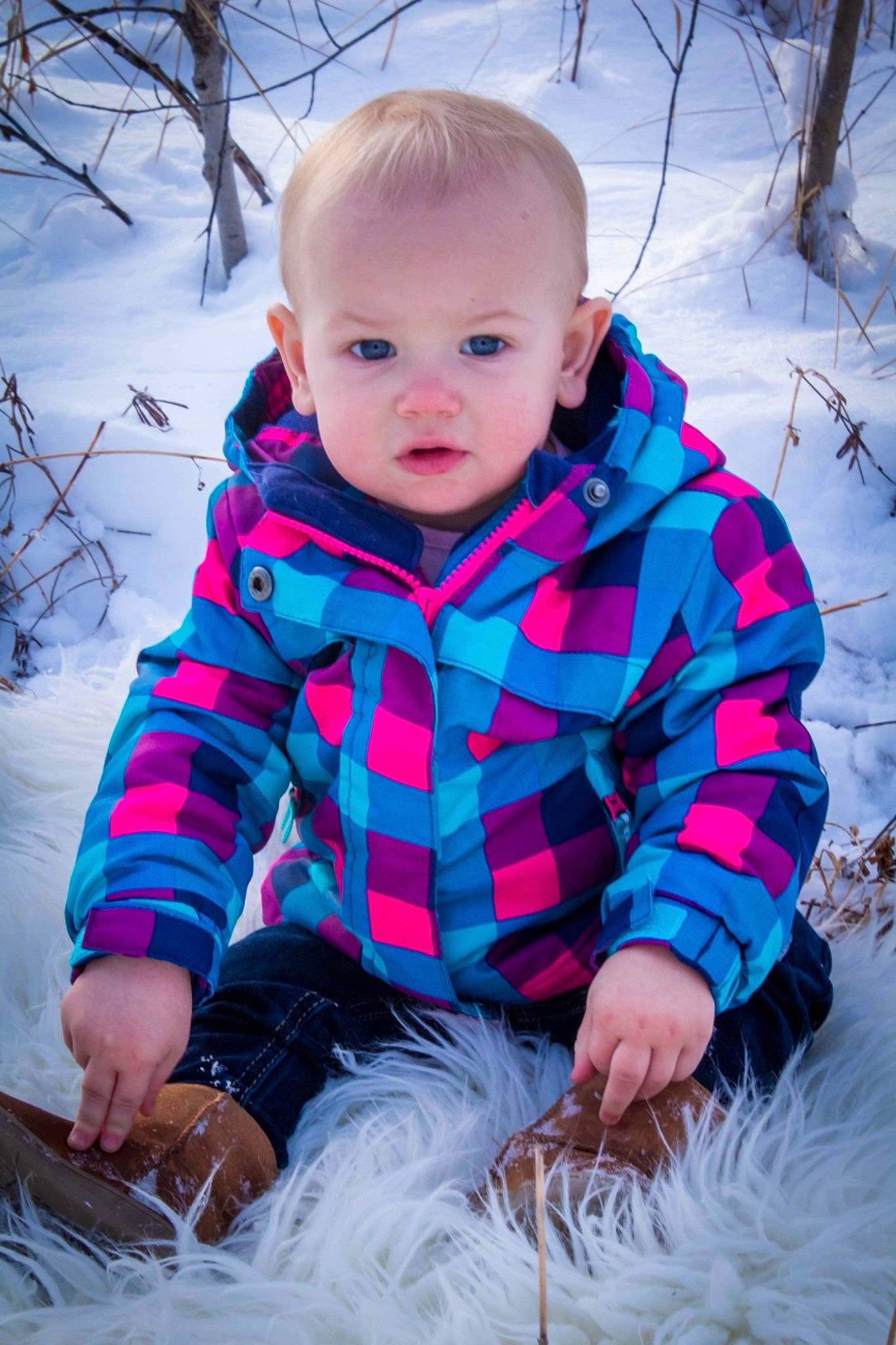 Oakley joined the competition — help win amazing prizes! baby, baby_toddler_clothing, cheek, child, design, eye, face, fur, grass, head, outerwear, pattern, person, photography, pink, plaid, sitting, skin, snow, toddler