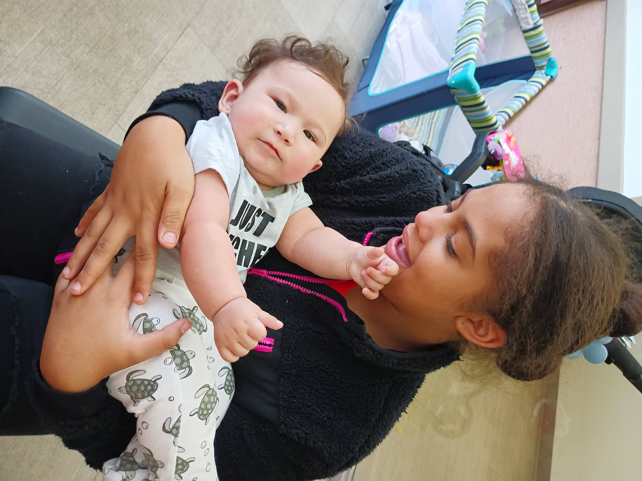 Adriel joined the competition — help win amazing prizes! baby, baby_products, baby_toddler_clothing, child, comfort, couch, event, facial_expression, fun, gesture, happy, interaction, joint, leisure, person, shoulder, sitting, skin, smile, toddler