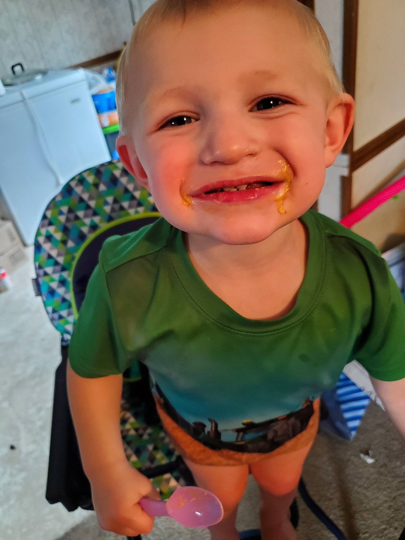 Colton is registered to the contest to win money with this photo: baby, baby_toddler_clothing, cheek, child, face, facial_expression, fun, head, joy, lip, mouth, neck, person, play, skin, smile, toddler, tooth