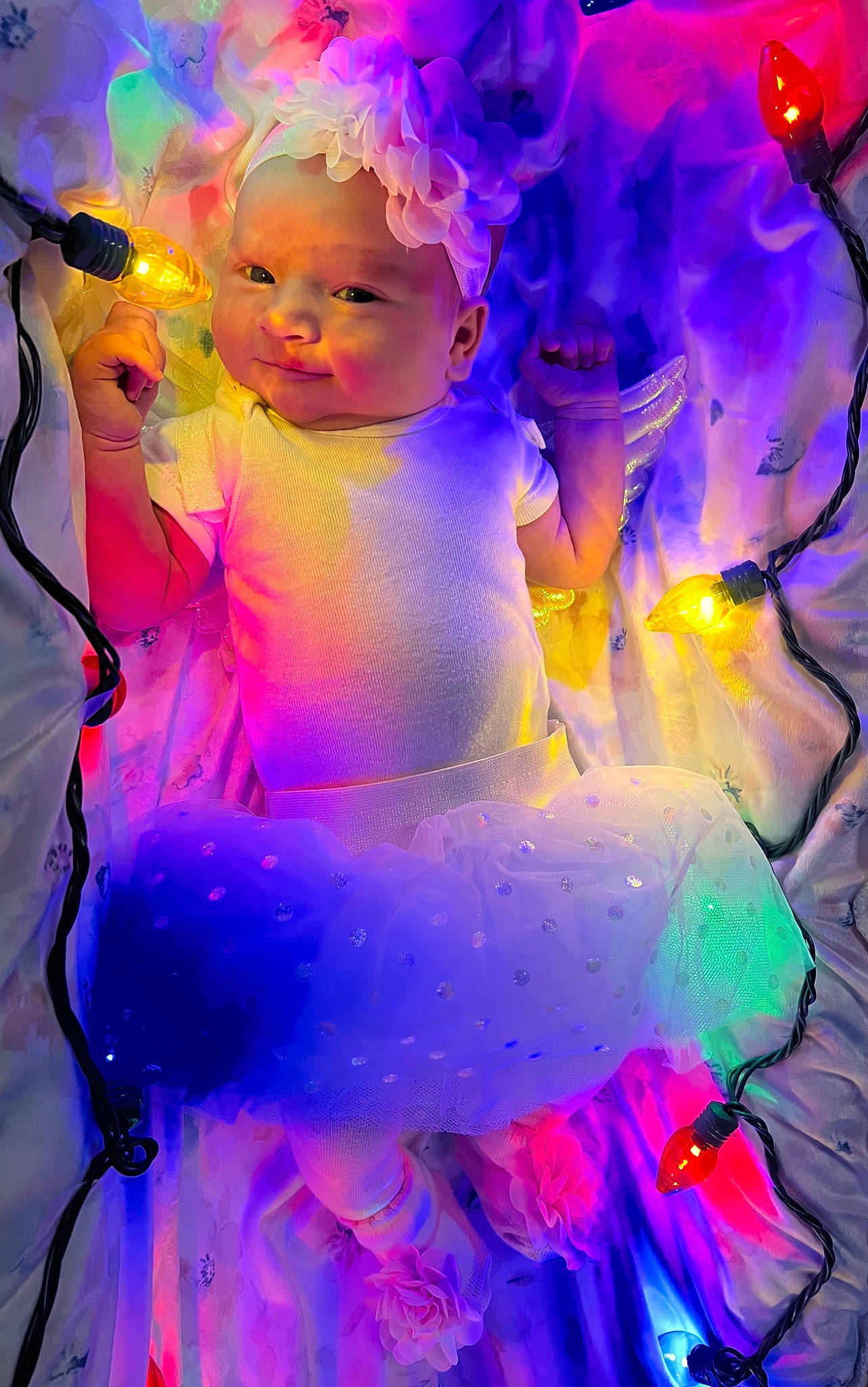 Maeve is registered to the contest to win money with this photo: angel, art, baby, christmas_decoration, electric_blue, entertainment, event, fictional_character, flash_photography, fun, graphic_design, happy, magenta, ornament, person, petal, pink, purple, teddy_bear, toddler