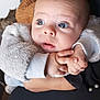 Kayron participe au concours pour gagner de l'argent avec cette photo : baby, infant, child, face, eyes, hands, clothing, jacket, fuzzy, person, holding, curious, skin, indoor, portrait, expression, cute, looking, young, warm