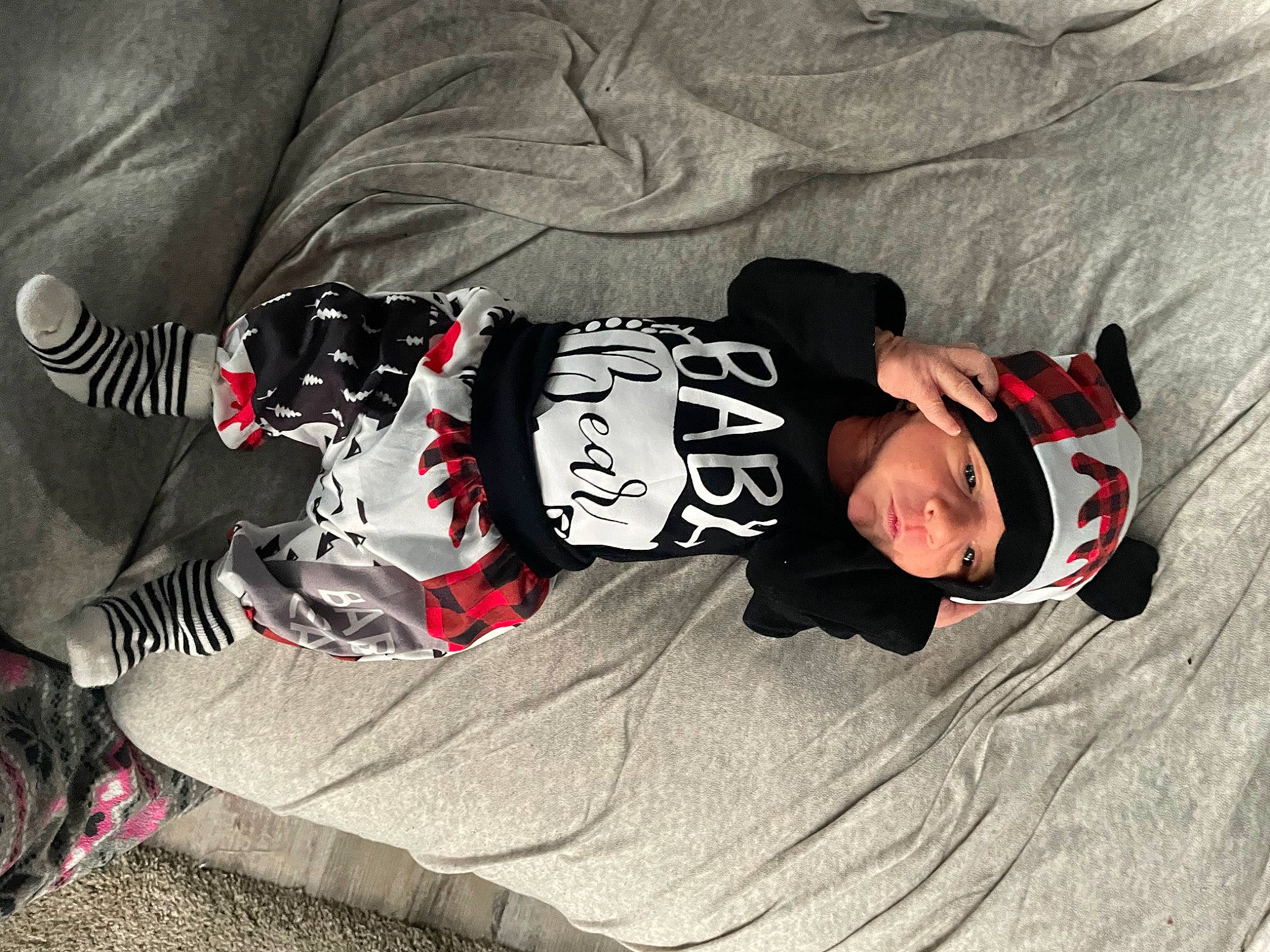 Austin joined the competition — help win amazing prizes! baby, baby_products, baby_toddler_clothing, carmine, child, comfort, fictional_character, font, headwear, human_leg, outdoor_shoe, person, personal_protective_equipment, sitting, sleeve, smile, sportswear, t_shirt, toddler, tree