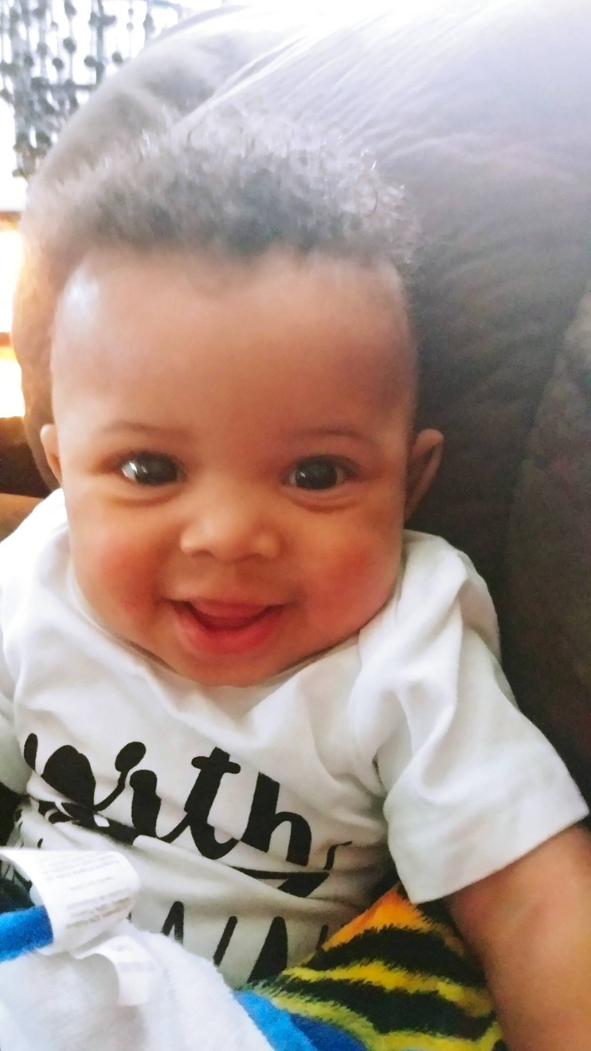 Malakai is registered to the contest to win money with this photo: baby, cheek, child, chin, cool, eyebrow, face, facial_expression, forehead, hair, hairstyle, head, joy, lip, nose, person, skin, smile, toddler