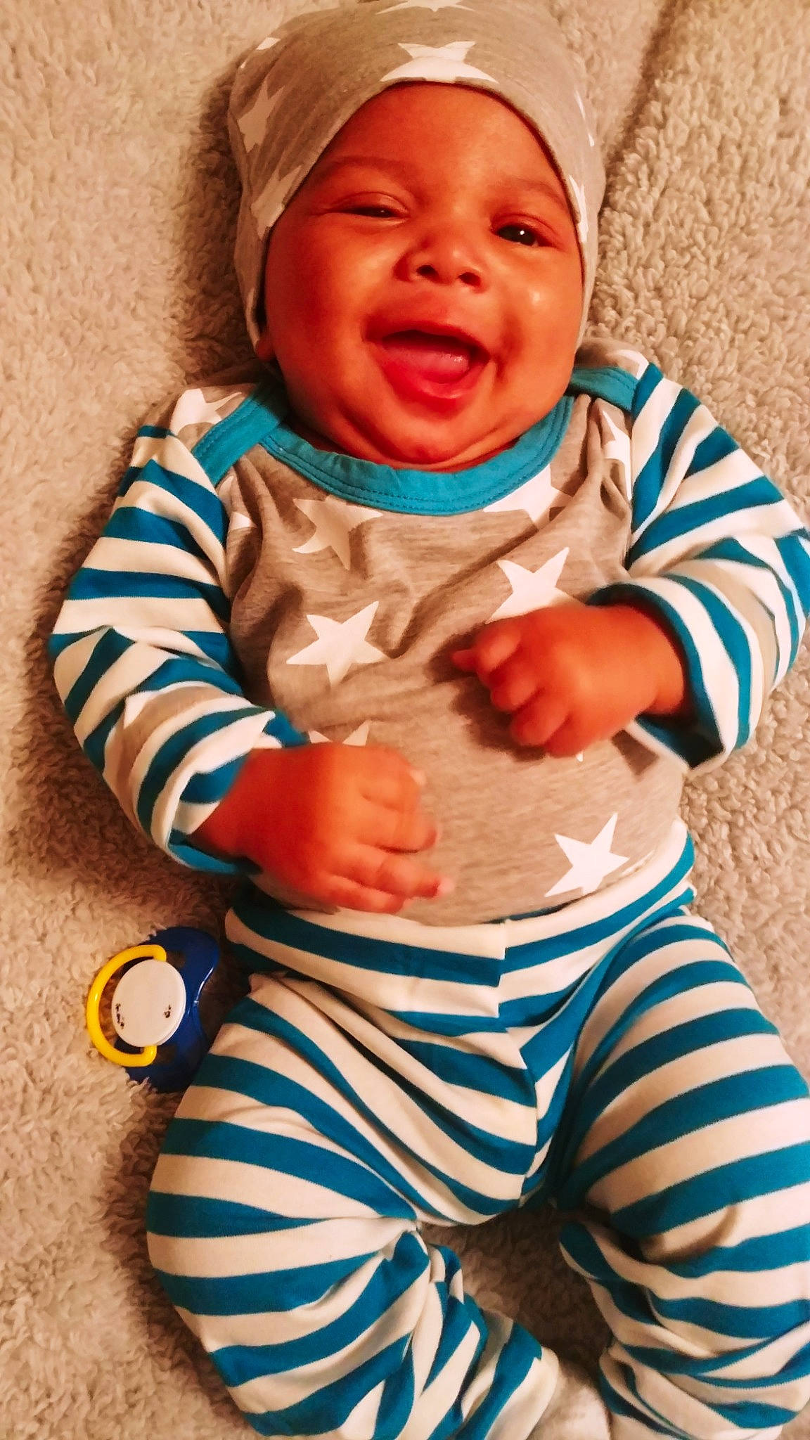 Malakai is registered to the contest to win money with this photo: baby, baby_laughing, baby_toddler_clothing, child, facial_expression, laugh, person, play, sleeve, smile, toddler
