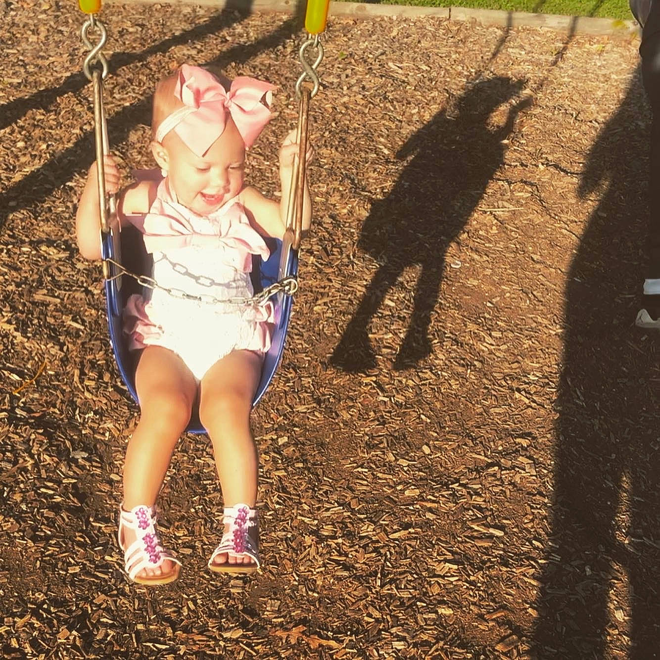Timber Mae joined the competition — help win amazing prizes! child, fawn, fun, grass, happy, leg, outdoor_play_equipment, person, photography, plant, play, recreation, shadow, smile, soil, sunlight, swing, tree