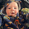 Rune joined the competition — help win amazing prizes! baby, blanket, blue_eyes, child, closeup, clothing, cozy, cute, dinosaur_pattern, expression, face, hoodie, indoors, infant, portrait, smiling, soft_lighting, warm, young_child, zipper