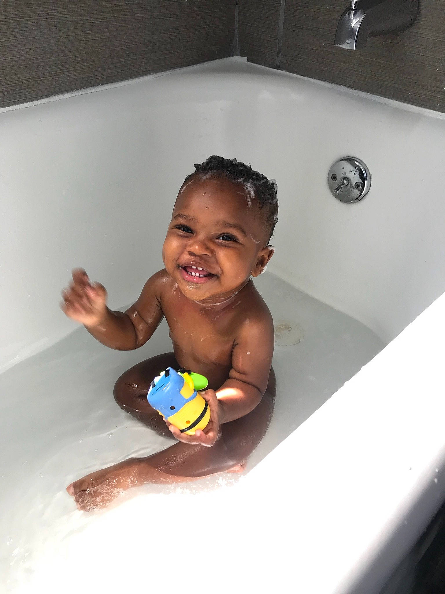 Massiah is registered to the contest to win money with this photo: baby_bathing, bathing, bathroom, bathtub, child, fun, happy, joy, leisure, person, play, plumbing_fixture, room, skin, smile, toddler, vacation, washing