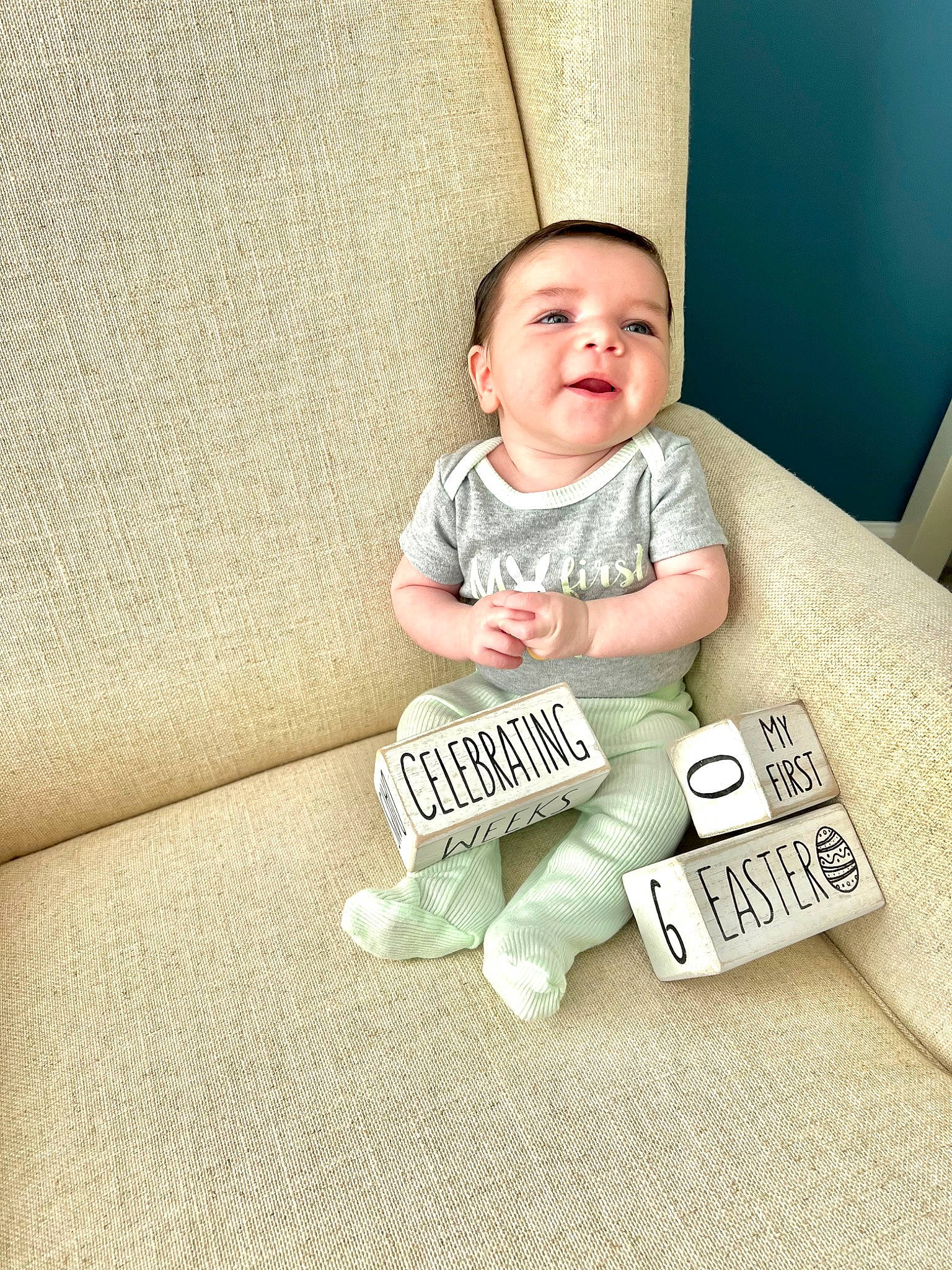 Banks joined the competition — help win amazing prizes! baby, baby_toddler_clothing, child, comfort, couch, facial_expression, flooring, font, gadget, grass, happy, illustration, linens, person, room, sitting, sleeve, t_shirt, throw_pillow, toddler