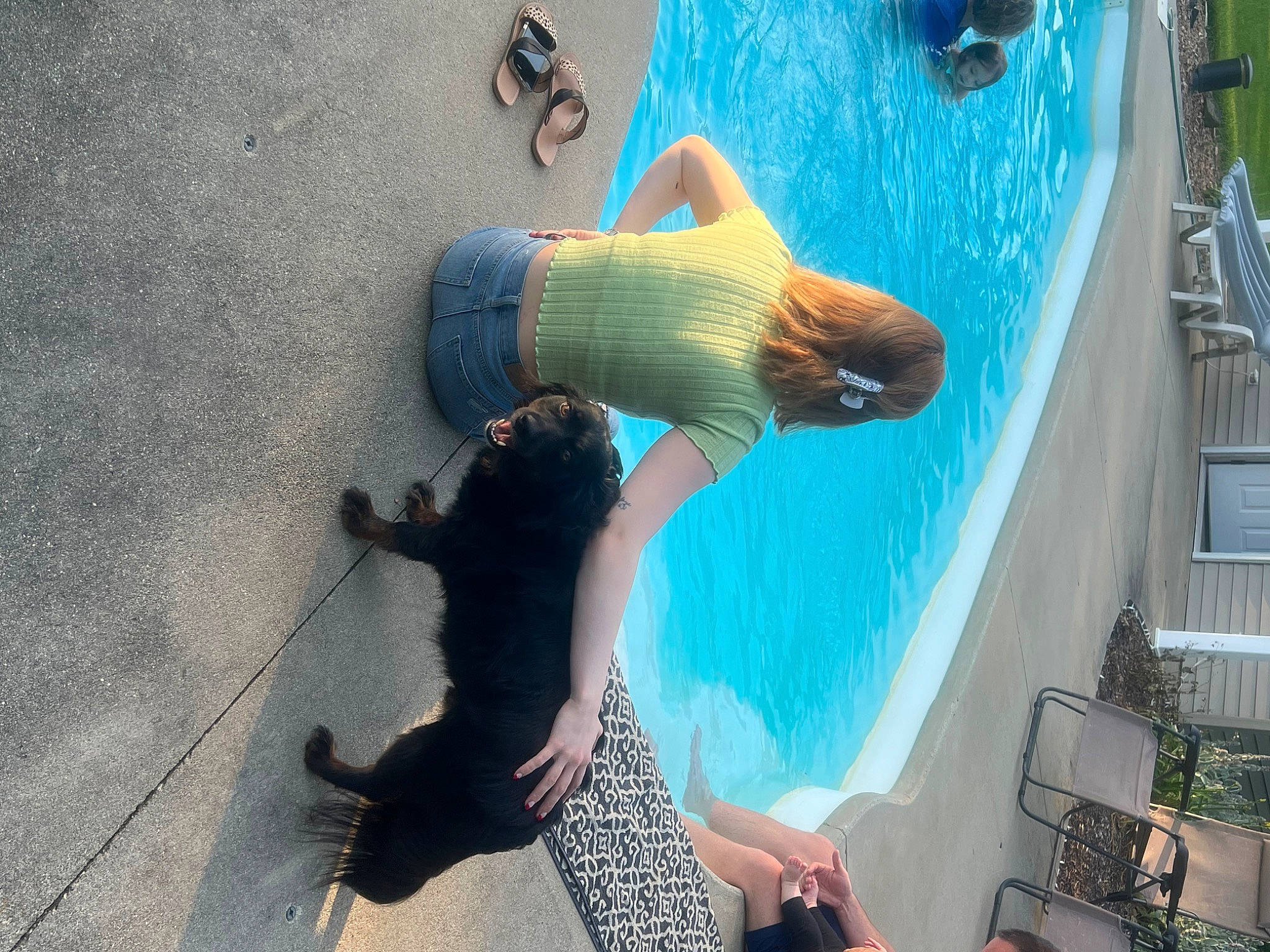 Ryder joined the competition — help win amazing prizes! companion_dog, dog_breed, elbow, felidae, foot, fun, fur, happy, human_leg, knee, leisure, recreation, shadow, small_to_medium_sized_cats, sporting_group, tail, thigh, toe, vacation, water