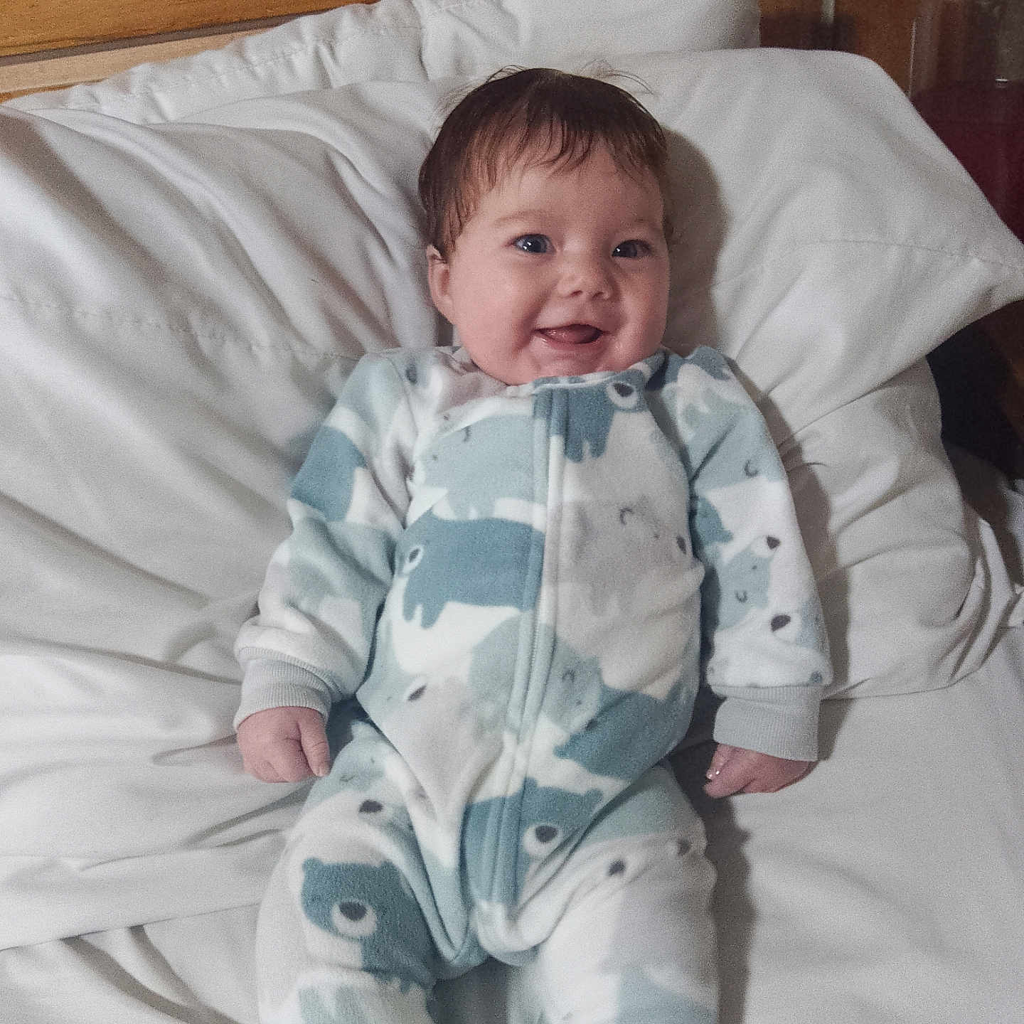Savanna is registered to the contest to win money with this photo: architecture, baby, bed, blanket, bodypart, building, clothing, crib, cushion, face, finger, furniture, hand, head, homedecor, infantbed, pajamas, person, photography, portrait