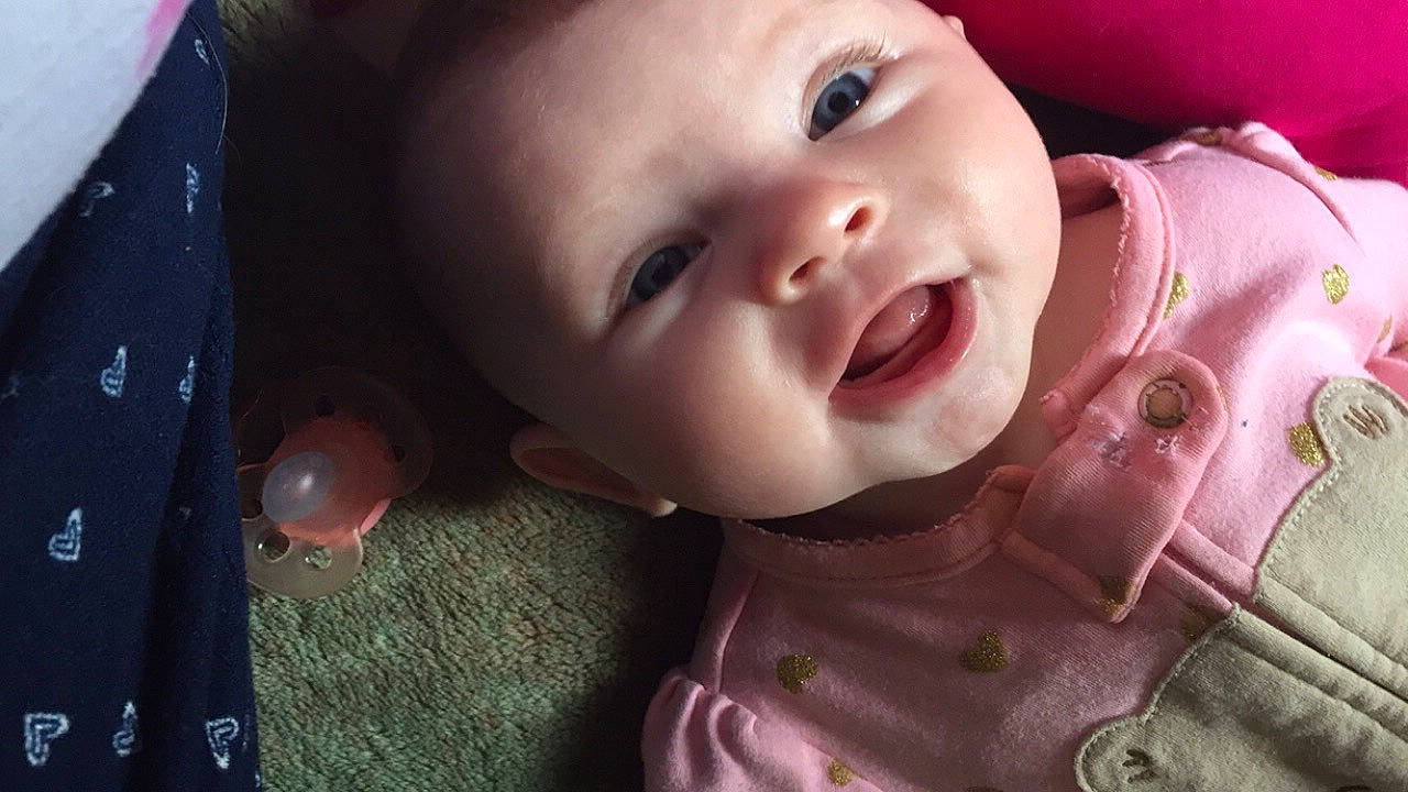Kenleigh joined the competition — help win amazing prizes! baby, cheek, child, chin, close_up, ear, eye, eyebrow, face, facial_expression, forehead, head, lip, mouth, nose, person, pink, skin, smile, toddler