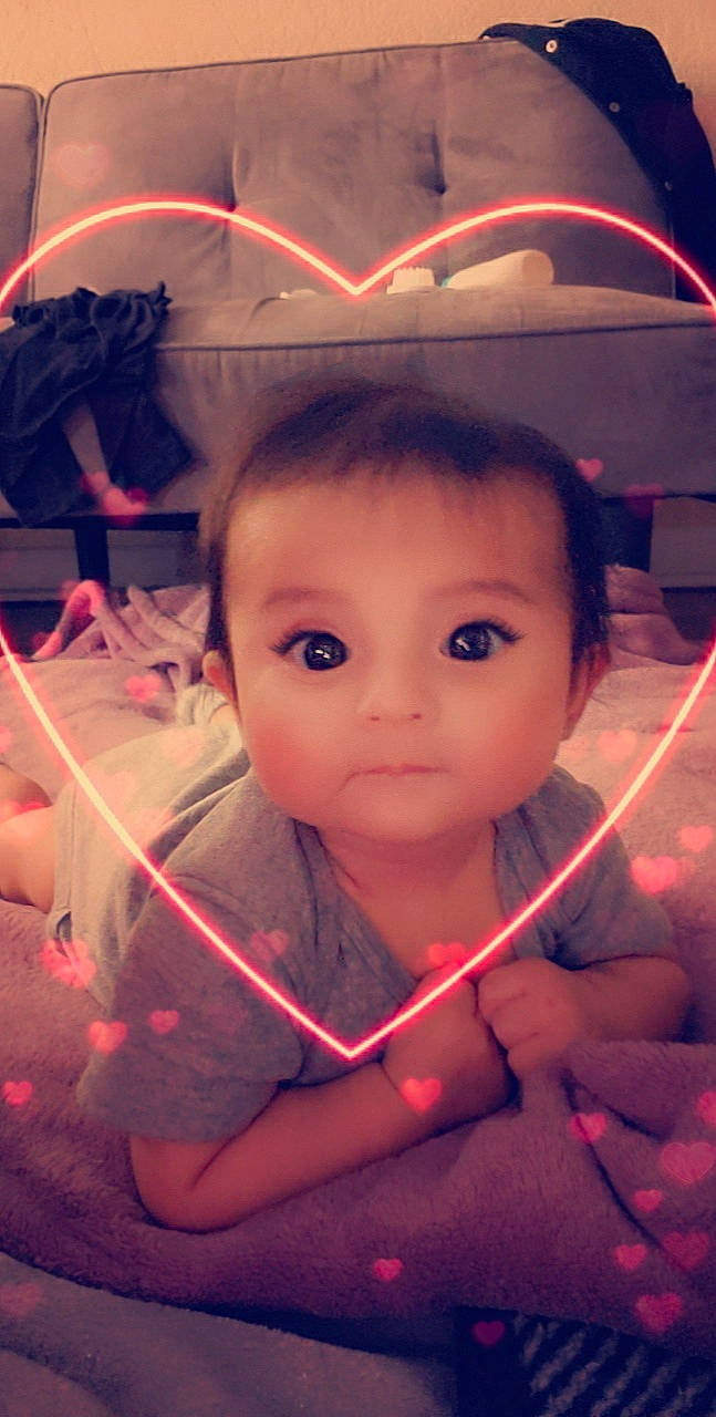 Azaylia is registered to the contest to win money with this photo: cheek, child, ear, eye, eyebrow, face, flesh, forehead, fun, head, lip, mouth, neck, nose, person, smile, toddler