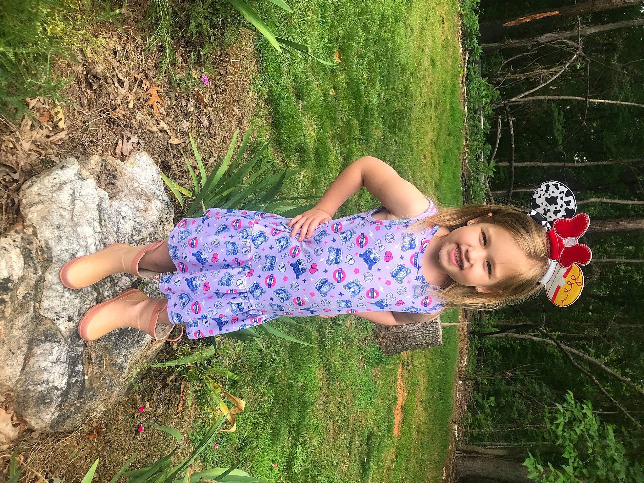 Kendall is registered to the contest to win money with this photo: child, day_dress, fun, grass, grass_family, grassland, happy, human_leg, joy, leisure, pattern, people_in_nature, person, plant, sandal, shrub, smile, spring, sunlight, thigh