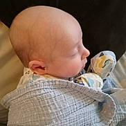 Alex is registered to the contest to win money with this photo: baby, infant, sleeping, blanket, wrapped, soft, cozy, face, profile, head, clothing, newborn, peaceful, skin, ear, indoors, resting, child, cute, serene