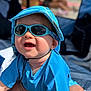 baby, beach, blue_clothing, child, closeup, cute, fun, happy, hat, infant, outdoor, portrait, sitting, smiling, summer, sun_protection, sunglasses, sunny, sunshine, vacation