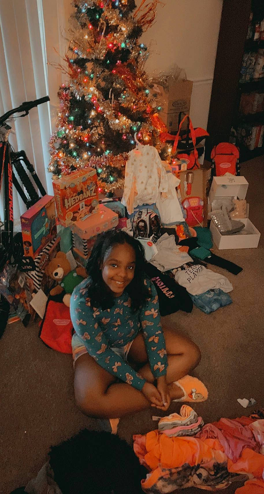 Aamani joined the competition — help win amazing prizes! black, christmas_decoration, christmas_ornament, christmas_tree, conifer, event, fun, happy, holiday, holiday_ornament, joy, lap, ornament, people, person, plant, room, sitting, smile, tradition