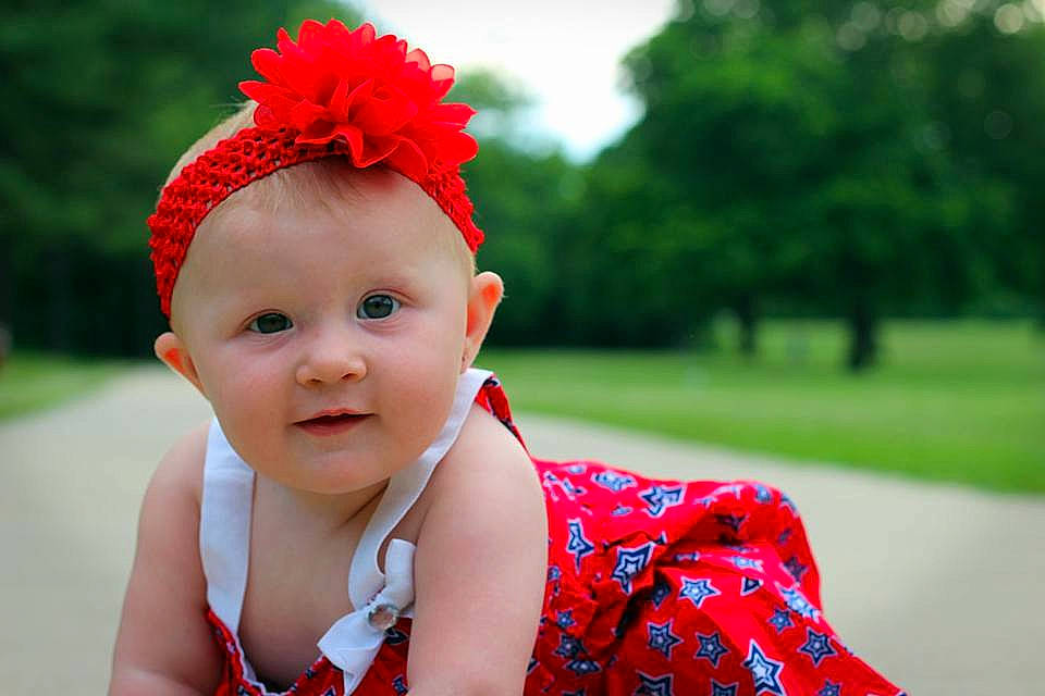 Blakelynn is registered to the contest to win money with this photo: cheek, child, flower, fun, girl, hair_accessory, happiness, headband, headgear, headpiece, infant, person, pink, plant, red, skin, smile, spring, toddler