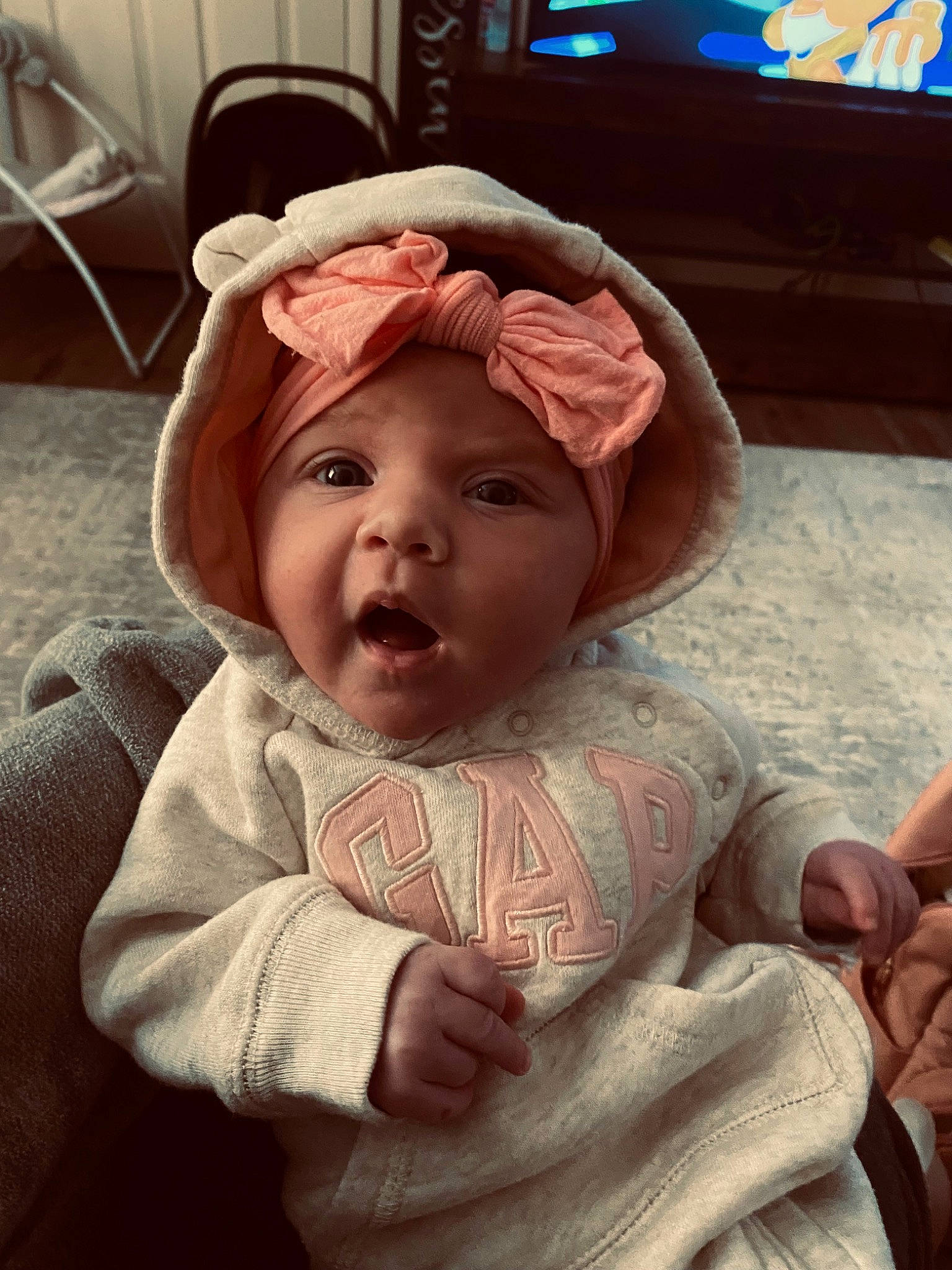 Jordynn is registered to the contest to win money with this photo: baby, baby_toddler_clothing, cheek, child, chin, comfort, finger, forehead, fun, gesture, hand, happy, headwear, lip, mouth, nose, person, pink, skin, sleeve