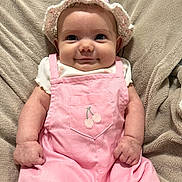 April joined the competition — help win amazing prizes! baby, child, infant, portrait, smiling, face, eyes, bonnet, headband, pink_overalls, clothing, cherries, sitting, blanket, cozy, indoors, close_up, adorable, fashion, photography