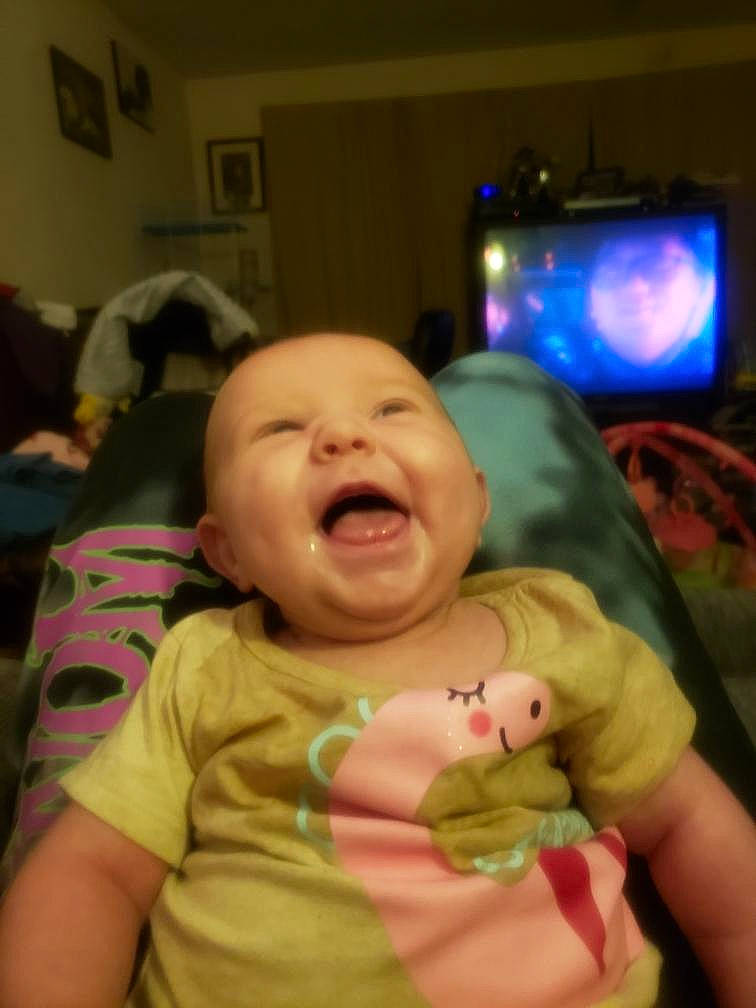 Heavenly is registered to the contest to win money with this photo: baby, baby_laughing, baby_toddler_clothing, cheek, child, comfort, event, fun, gesture, happy, iris, lip, mouth, nose, person, room, skin, smile, television, thumb