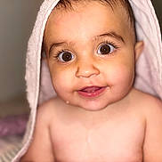 Remiah-Rose is registered to the contest to win money with this photo: baby, child, towel, face, eyes, smile, skin, portrait, cute, infant, expression, indoors, soft, young, person, head, mouth, cheeks, newborn, closeup