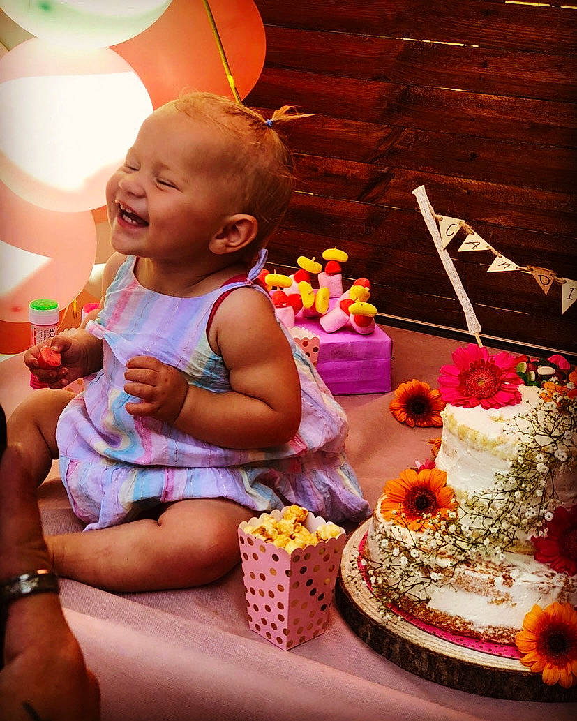 Candice participe au concours pour gagner de l'argent avec cette photo : baby, baby_toddler_clothing, birthday_cake, cake, cake_decorating, cake_decorating_supply, dress, food, happy, lighting, orange, person, photograph, pink, shorts, smile, sugar_cake, sweetness, tableware, toddler