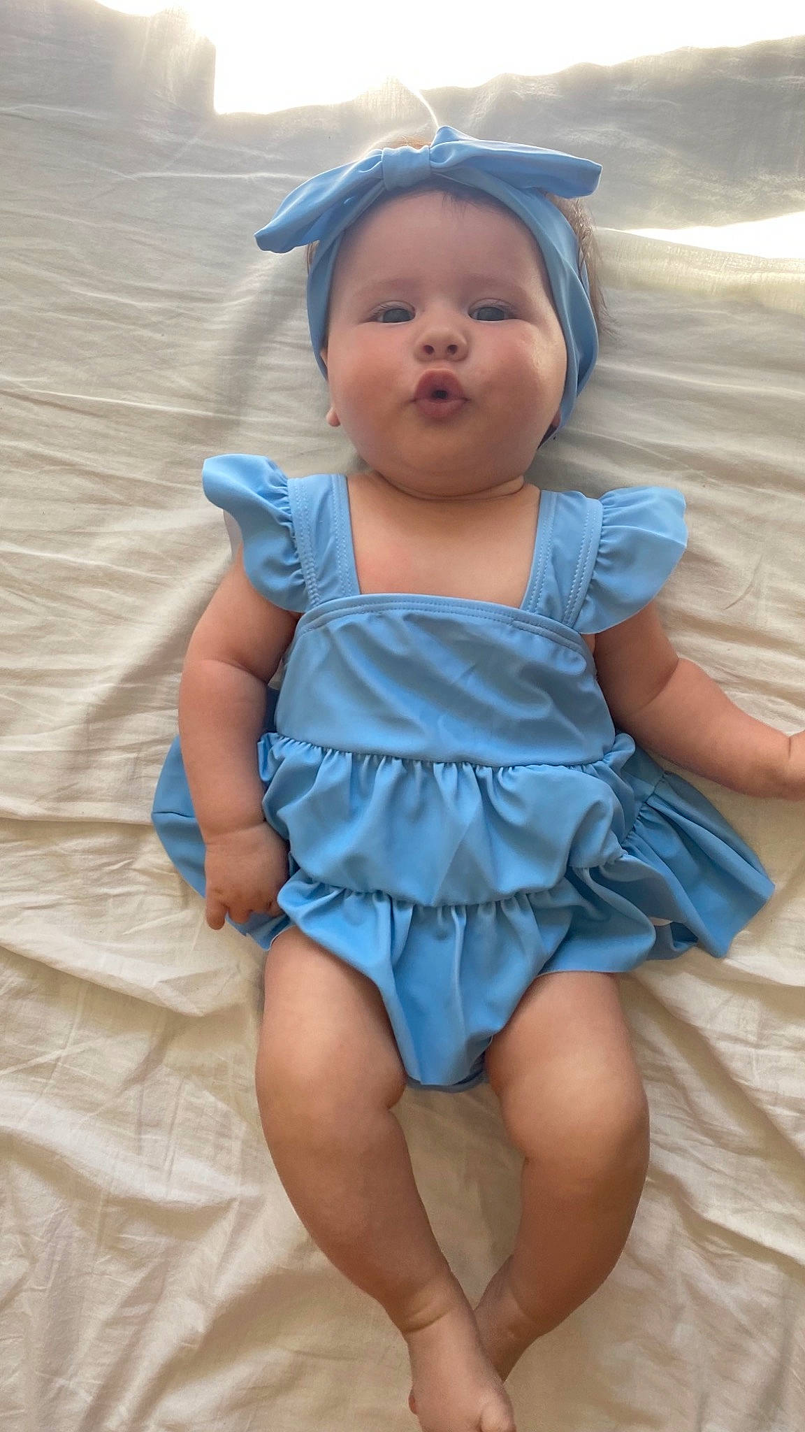 Juna participe au concours pour gagner de l'argent avec cette photo : azure, baby, baby_toddler_clothing, child, day_dress, dress, electric_blue, finger, happy, headwear, human_leg, iris, one_piece_garment, person, pink, skin, sleeve, smile, thigh, thumb