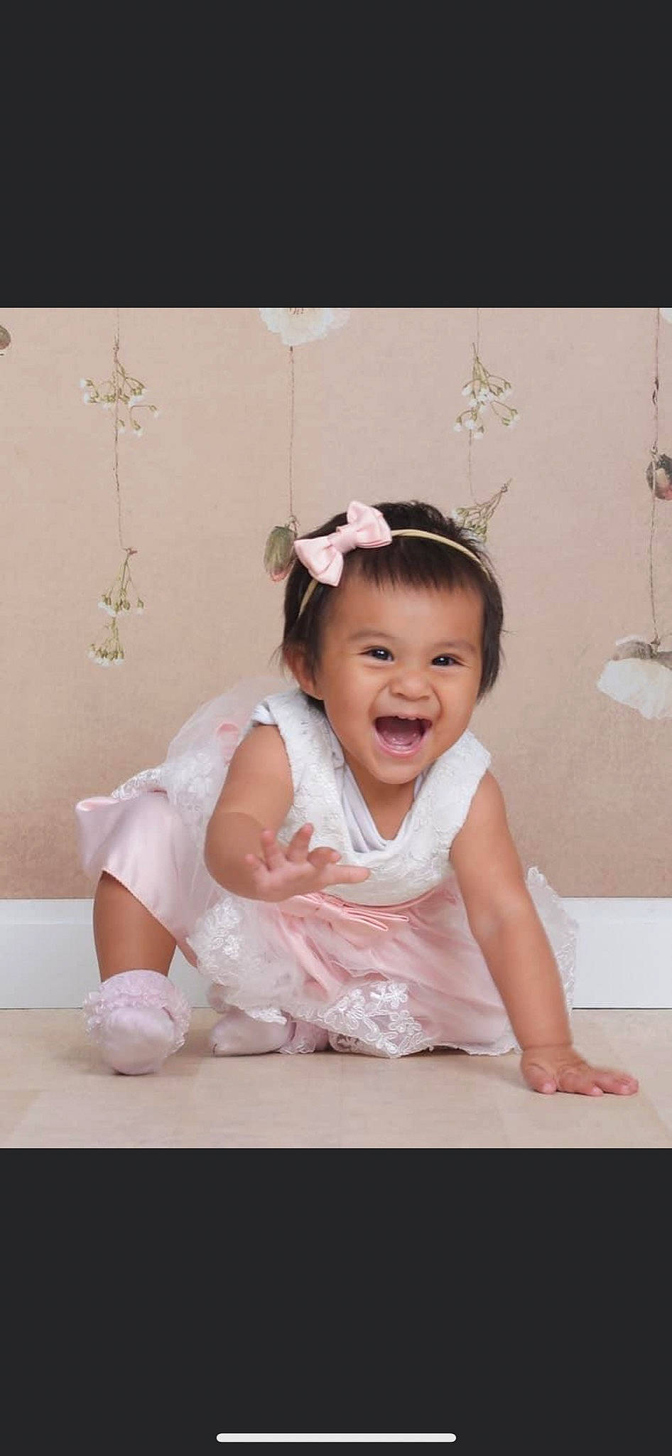 Jade Ana is registered to the contest to win money with this photo: baby, baby_toddler_clothing, bridal_accessory, dress, embellishment, event, flash_photography, hair_accessory, happy, headband, headgear, headpiece, iris, jewellery, joy, person, petal, picture_frame, pink, sleeve