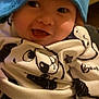 child, baby, infant, beanie, hat, smile, smiling, happy, cheeks, eyes, onesie, panda_print, clothing, closeup, portrait, cozy, indoor, headwear, cute, expression