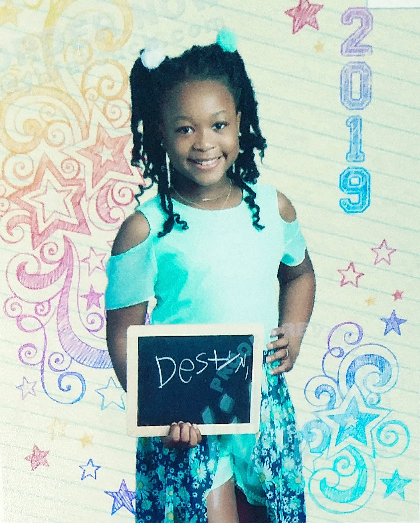 Destyni is registered to the contest to win money with this photo: black_hair, blue, child, child_model, cool, hairstyle, happy, joy, person, photo_shoot, smile, style, t_shirt, toddler, turquoise